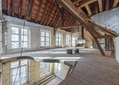 Travaux d'isolation des combles aménagés réalisés par BATIMATOS dans un duplex rue de l'Université à Paris